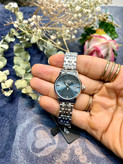 ساعت زنانه الگانس با زمینه طوسی